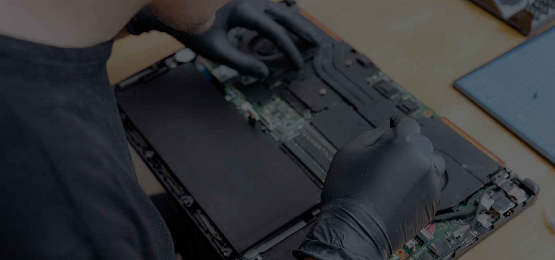 PCMaster Pro Technician repairing a new laptop